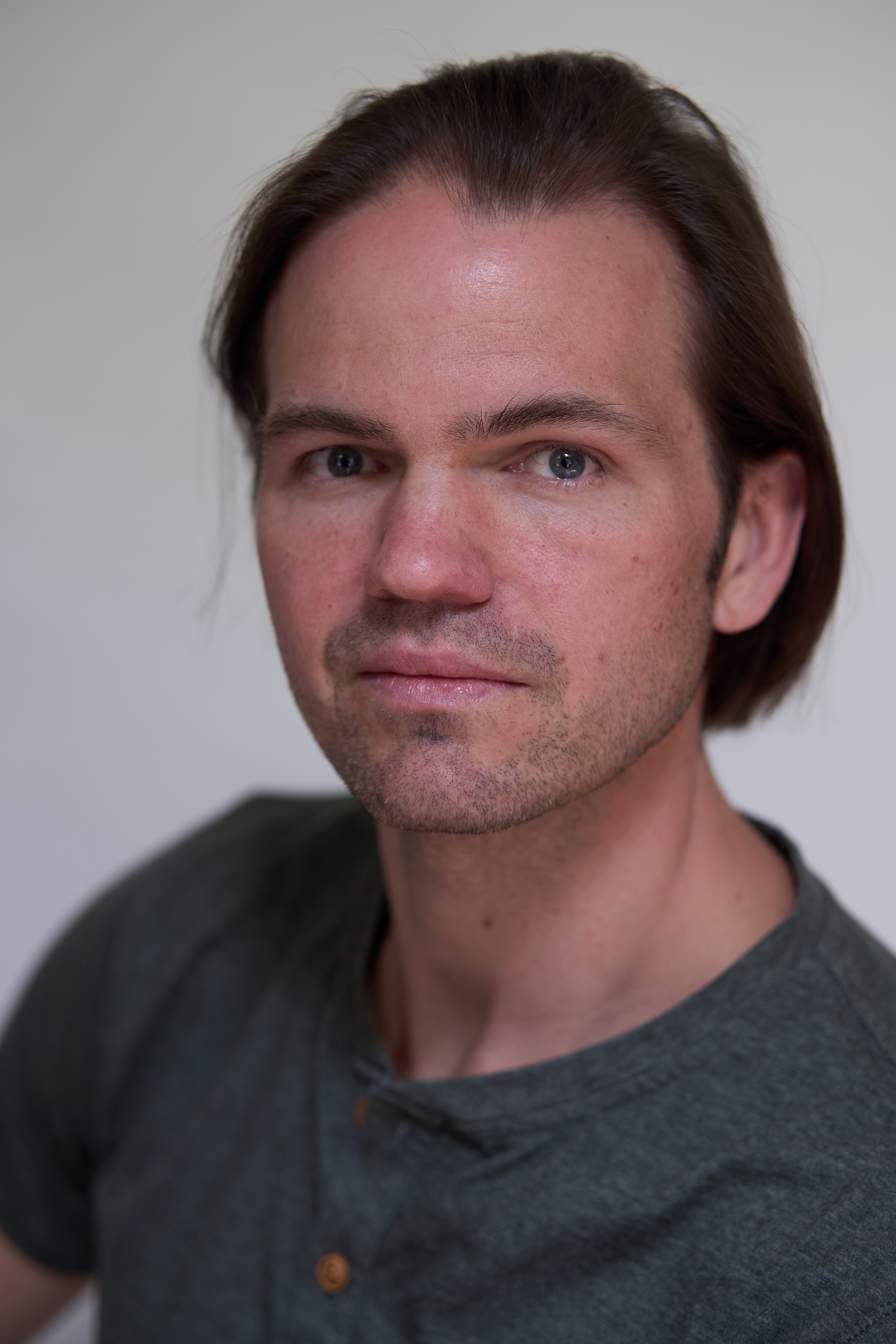 Actor headshot of Zane in a neutral studio portrait, photographed in Charlotte
